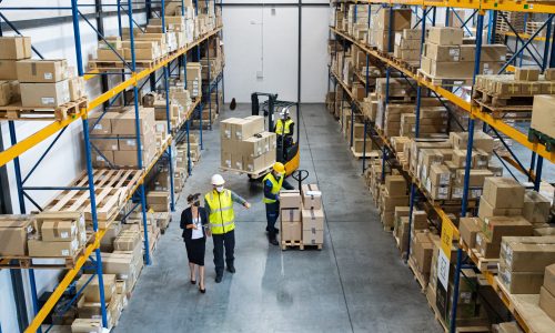 Top view of a group of workers with manager working indoors in warehouse, coronavirus concept.
